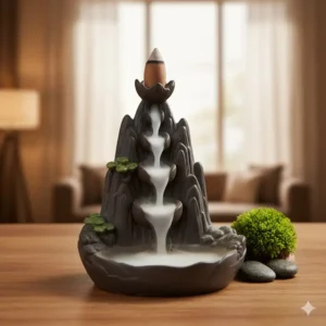 Decorative backflow incense burner holder creating a mesmerizing smoke waterfall effect on a wooden table.