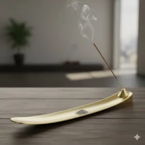 Elegant brass incense burner holder with a long boat shape, acting as an effective ash catcher for stick incense.