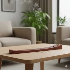 Illustration 2 (Ash Catcher): Long, wooden tray incense holder for sticks designed as an efficient ash catcher, with burning stick and scattered ash.
