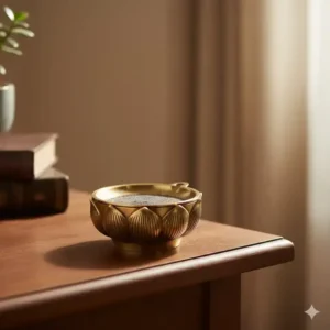 Interior view of the metal incense burner showing the removable ash catcher tray for easy cleaning and maintenance.