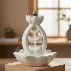 Close up of a lotus shaped inverted incense burner with white smoke pooling in the ceramic petals.