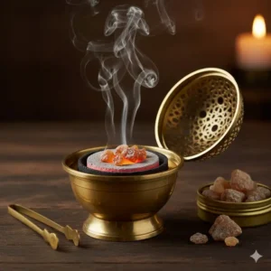 A traditional brass incense burner with a screen top designed for burning resin tears on charcoal disks.