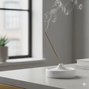 Modern white ceramic incense holder with a sleek circular design for minimalist home decor.