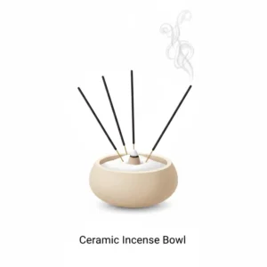 A minimalist ceramic bowl filled with sand, used as versatile types of incense holders for sticks.