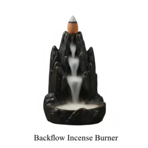 An artistic backflow burner creating a smoke waterfall, popular among modern types of incense holders.