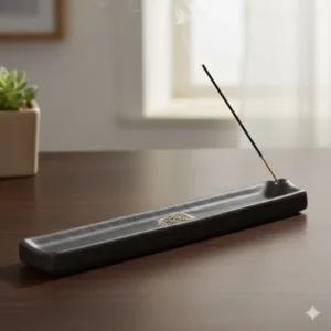 A long rectangular ceramic incense holder designed to catch falling ash and keep surfaces clean.