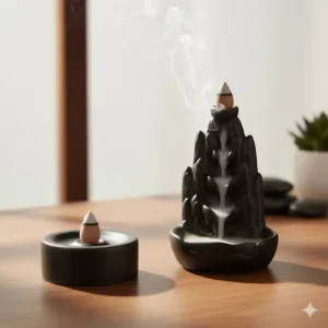 Sleek modern minimalist incense cone burners in matte black finish on a wooden table.