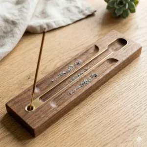 A long wooden incense holder designed as a functional ash catcher tray.