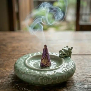 Eco-friendly cardboard box packaging filled with organic conical incense cones for aromatherapy.