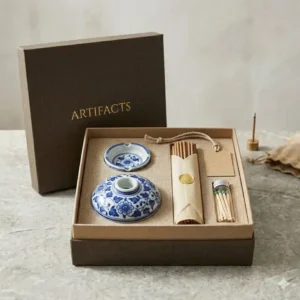 An elegant unboxing of a premium gift set containing an incense burner stick holder and incense sticks.