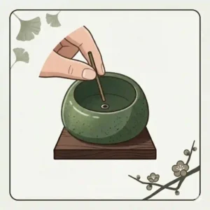 Illustration demonstrating how to safely place a short incense stick into a japanese incense holder tray.